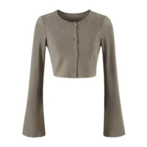 Detailed close up shot of women solid color long sleeve flare sleeve crop cardigan top