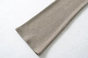Close-up shot of the soft ribbed knit sleeve fabric in khaki, showing fine texture and detail.