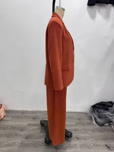 Detailed view of the stylish women corduroy blazer and trousers suit, elegant casual outfit.