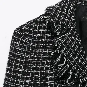 Classic black and white tweed blazer for women featuring chic fringe details and texture.