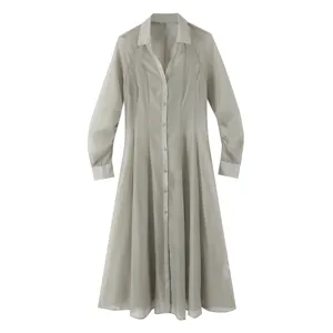 Elegant sheer long shirt dress with V-neck and buttons for stylish women commuting.