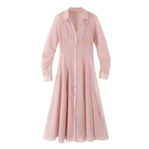 Pink sheer texture long sleeve shirt dress detail view, elegant V-neck and button design.
