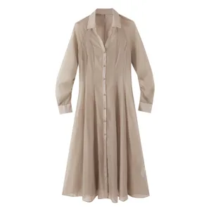 Detailed view of the sheer textured khaki shirt dress featuring long sleeves and lapel collar.