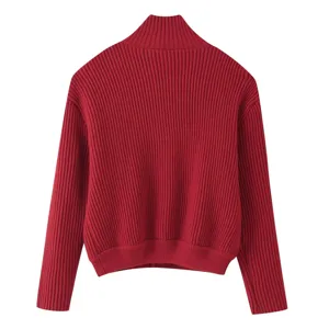 Detailed view of women's red turtleneck knitted cardigan showing back ribbed texture and design.