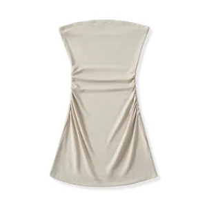 Beige strapless tube top detail showing elegant ruching design and slim fit texture.