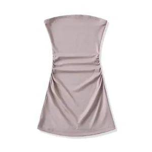 Detail shot highlighting the stylish ruched waist and smooth fabric of the elegant tube top.