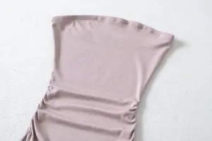 Close-up detail of women's ribbed strapless tube top showing ruched side texture.