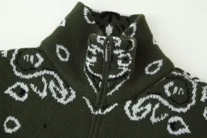 Dark green zip-up knit sweater detail, stand collar and classic paisley pattern design.