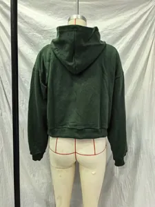 Back view detail of the dark green washed hoodie featuring a cozy hood and ribbed hem.