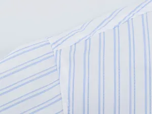 Close-up view of blue and white striped shirt shoulder featuring fine stitching and soft fabric.