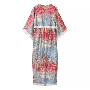 Detailed shot of the stylish printed long dress showcasing the intricate landscape pattern.