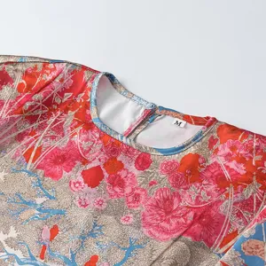Close-up detail of women floral print blouse collar with size M tag, elegant design.