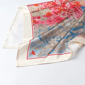 Chic floral printed satin silk scarf with vibrant botanical patterns and elegant border.