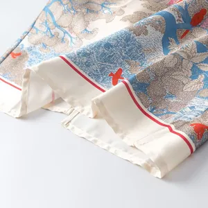 Elegant printed silk scarf detail with nature bird pattern, chic fashion accessory for women.