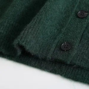Dark green knit cardigan detail view, stylish fashion women long sleeve button up sweater.