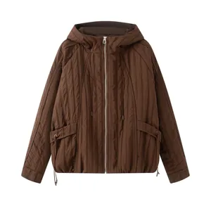 Detail shot of women's brown hooded padded jacket featuring front zipper and quilted texture.