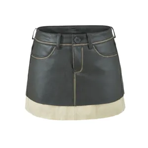 Vintage PU leather colorblock mini skirt detail showcasing contrast stitching and hem design.