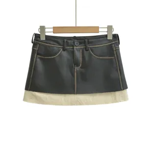 Retro wasteland style PU leather contrast color mini skirt, unique layered detail.