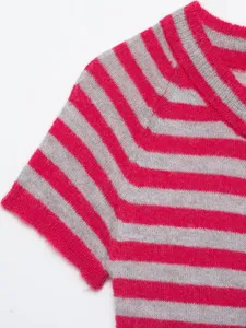 Close-up detail of soft pink and grey striped knit fabric, showing short sleeve texture.