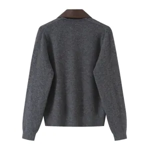Back detail of women grey knit cardigan with brown leather contrast collar, soft knit texture.