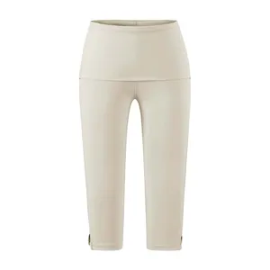 Beige hoge taille cropped yoga leggings met brede tailleband en stijlvolle splitmanchetten.