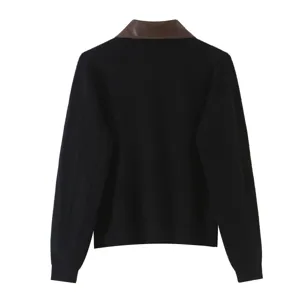Details of black knit cardigan featuring brown contrast collar back view close up shot