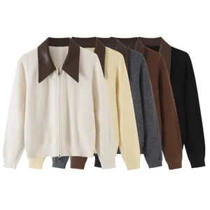 Details of the contrast leather lapel and smooth metal zipper on the stylish knit cardigan.