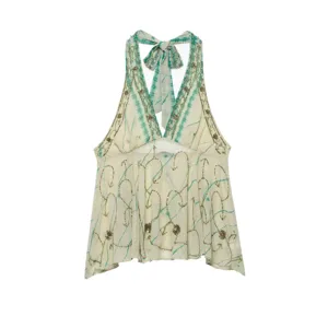 Detailed view of the stylish women's halter neck backless top with green tie-dye and gold sequins.