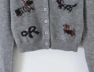 Gray knit cardigan featuring cute dachshund and bow patterns, long sleeves with button-down front.