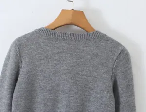 Grey knit cardigan sweater back detail view, soft knitwear fabric texture, cozy daily apparel.
