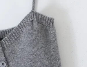 Grey knit camisole strap detail close up, soft fabric texture, minimalist style fashion top.
