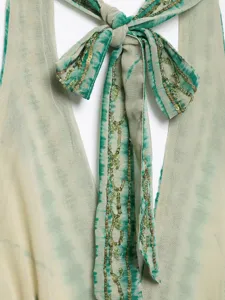 Chic tie-dye halter neck top with sequin embroidery, stylish backless design for summer.