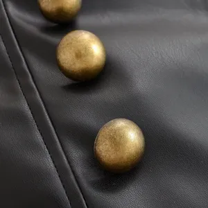 High waist black leather shorts featuring vintage metal buttons, detailed main product view.