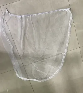 Detailed view of white baby stroller mosquito net with lace trim and breathable mesh.