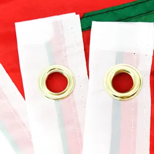 Close-up detail view of reinforced white flag header featuring solid brass grommets for hanging.