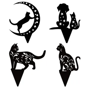 Detailed view of black metal cat and dog garden stakes with hollow floral and star designs.