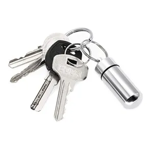 Portable outdoor metal pill bottle keychain, mini waterproof capsule container detail view.