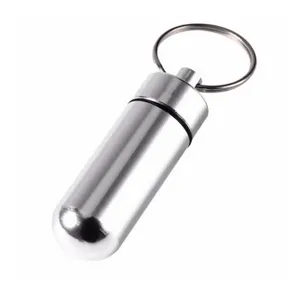 Portable aluminum pill box keychain capsule container for outdoor travel and daily use.