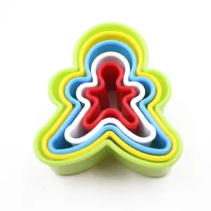Detail shot of plastic gingerbread man cookie cutter set, nested design for baking molds.