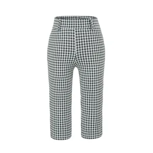 Close-up detail shot of black and white checkered high-waist cropped pants pattern.