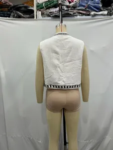 Sleeveless embroidered vest for women, casual commuter style with stylish black trim details.