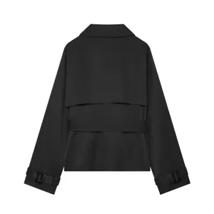 Back detail of black short trench jacket, showing lapel, back cape, and belted cuffs.