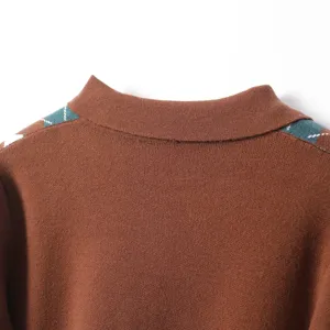 Close-up detail of a brown knit sweater featuring a stylish lapel and chic argyle shoulder.