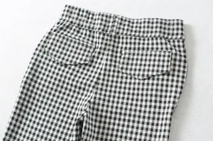 Black and white checkered pattern detail of women's slim casual cropped pants back view.