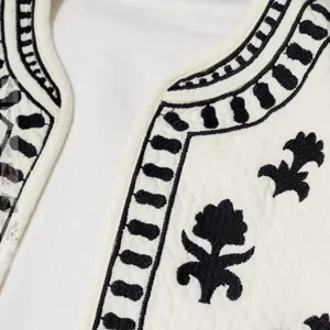 Discover this stylish embroidered open front vest, featuring classic black and white boho design.