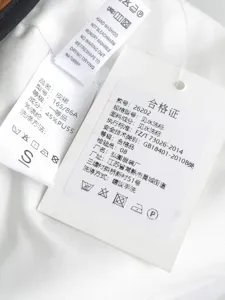 PU leather skirt detail shot showing quality fabric composition, size tag and washing instructions.