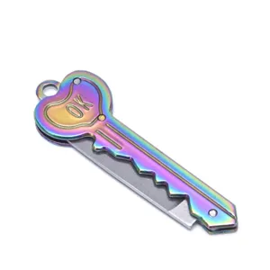 Close-up detail of the mini rainbow key pocket knife featuring a stylish heart shape and blade.