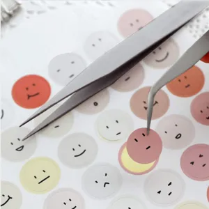 Cute round smiley face sticker set with metal precision tweezers for daily crafting and decor.
