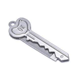 Close up view of stainless steel mini key pocket knife blade detail, portable camping tool design.