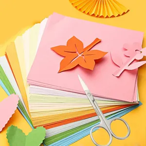 Colorful craft paper and scissors set for DIY art projects and handmade paper cutting crafts.